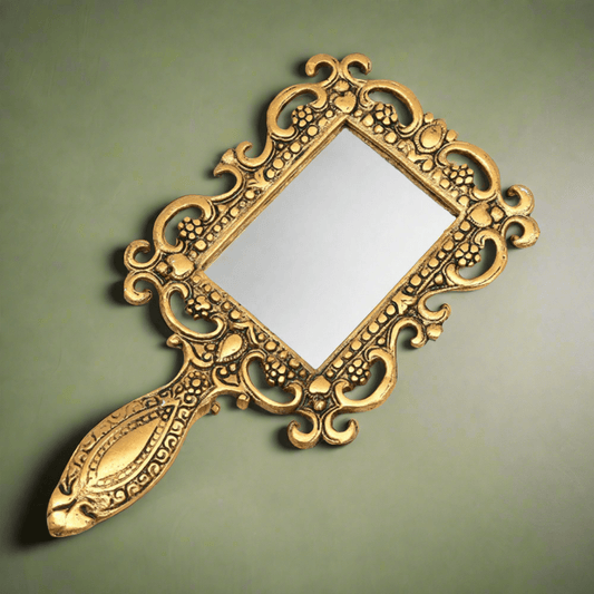 Antique metal hand mirror with oxidized golden polish, handcrafted vanity accessory