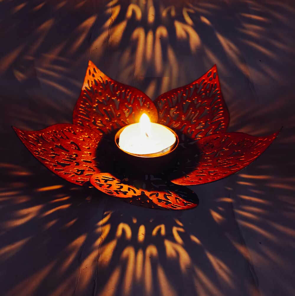 Metal lotus candle stand with bloomed leaves design, perfect for temple decoration at home and office.