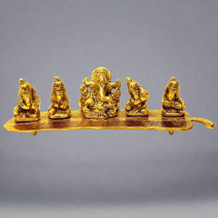 A metal musician Ganesh statue with a golden oxidized polish, featuring five Ganesha playing music.