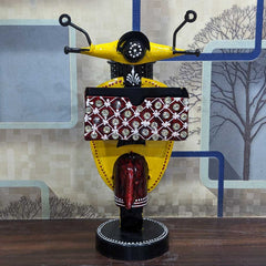 A metal scooter desk caddy for convenient pen, pencil, and card storage.