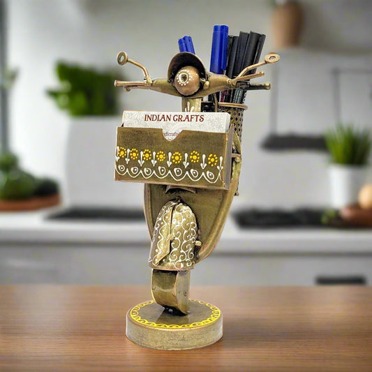 A hand-painted metallic pen and card holder with a unique scooter shape.