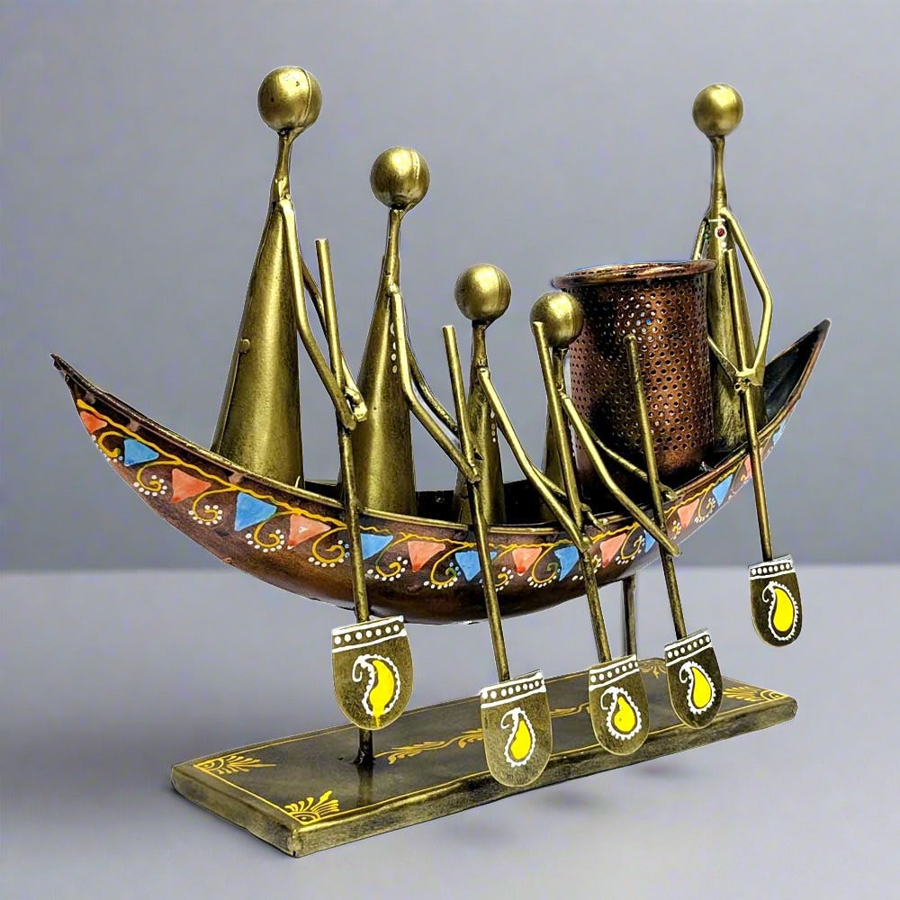 A fine quality metal pen stand with a tribal art design, perfect for an office desk or table.