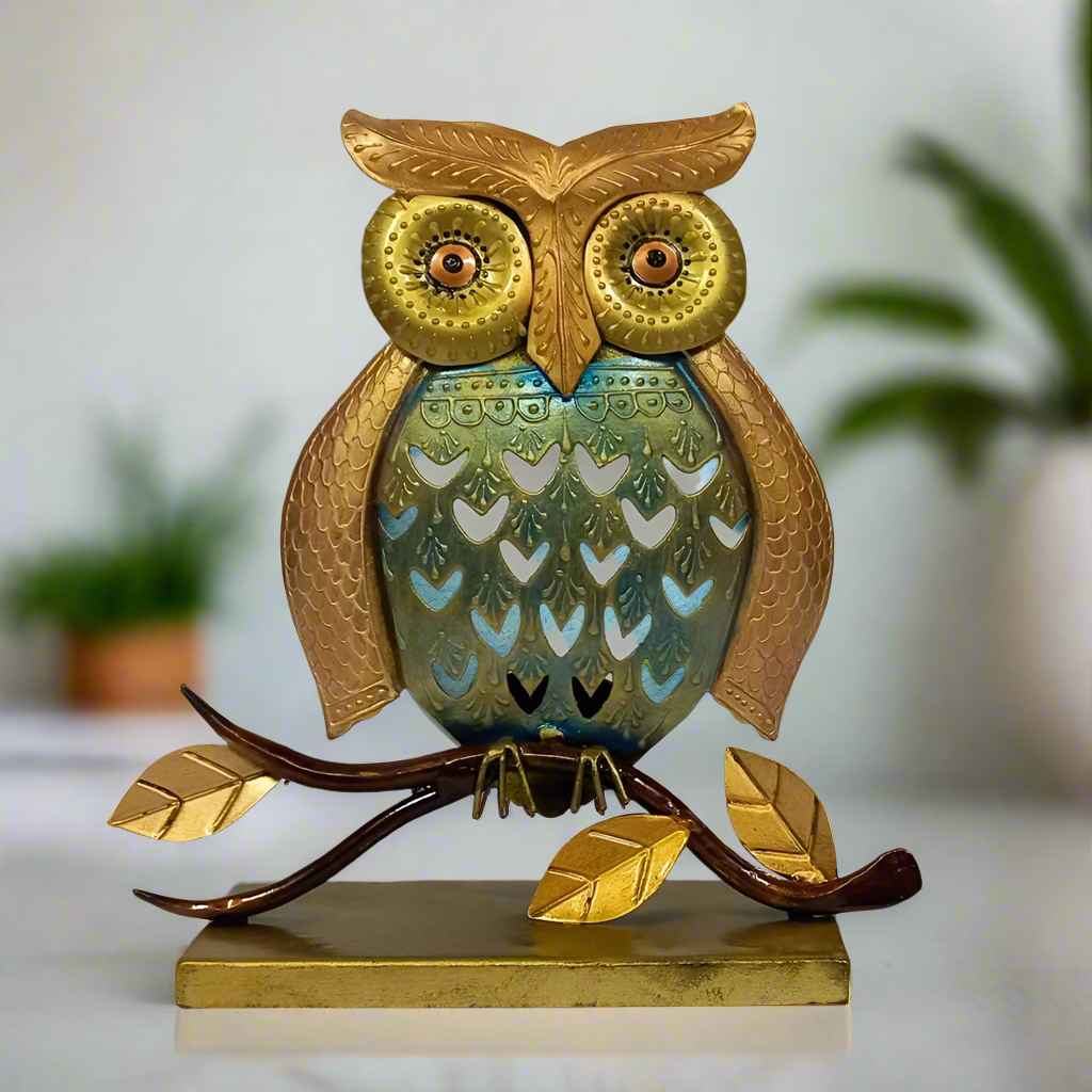 Antique metal owl tea light candle holder with intricate mesh design.