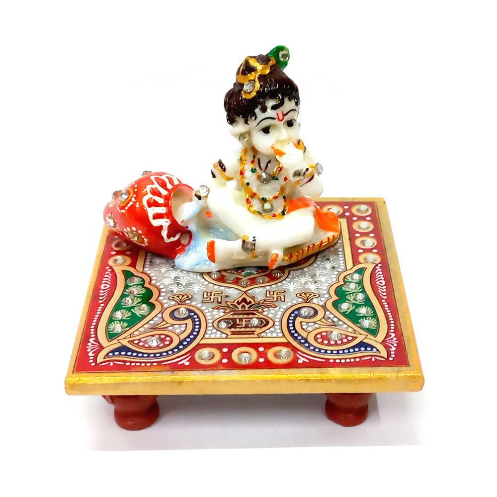 Painted marble Chowki Krishna idol with golden and colorful detailing.