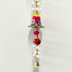 A papermache door valance featuring hand painting and a beautiful design.