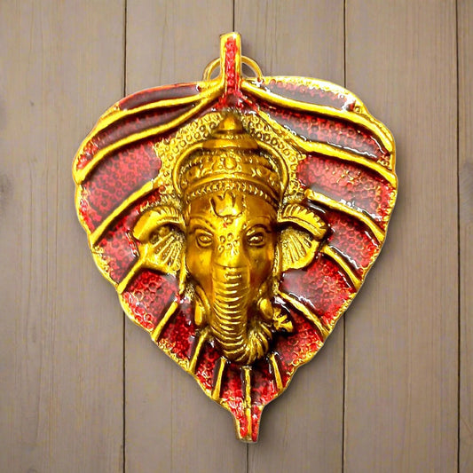 Patta Ganesha wall décor showpiece in red, yellow, white, and green colors.