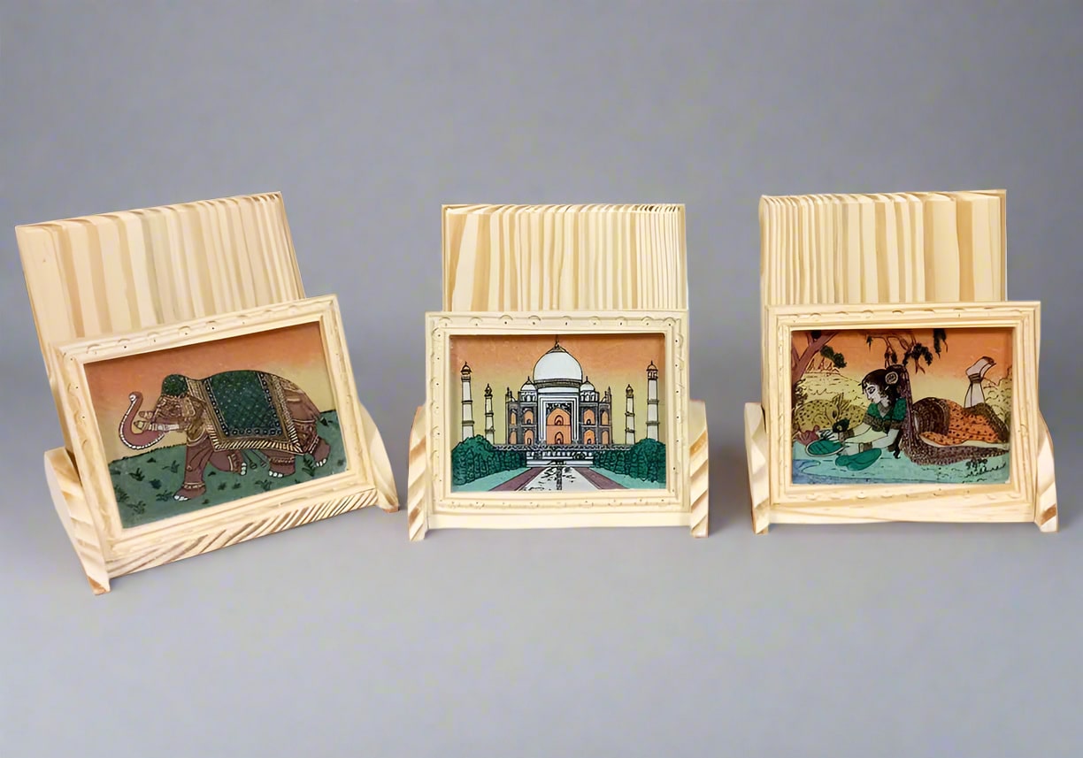 Wooden mobile holder featuring intricate gemstone artwork and ergonomic design