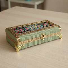 Handcrafted wooden dry fruit box wrapped in pista-colored designer cloth featuring premium top embroidery and golden floral metal borders.