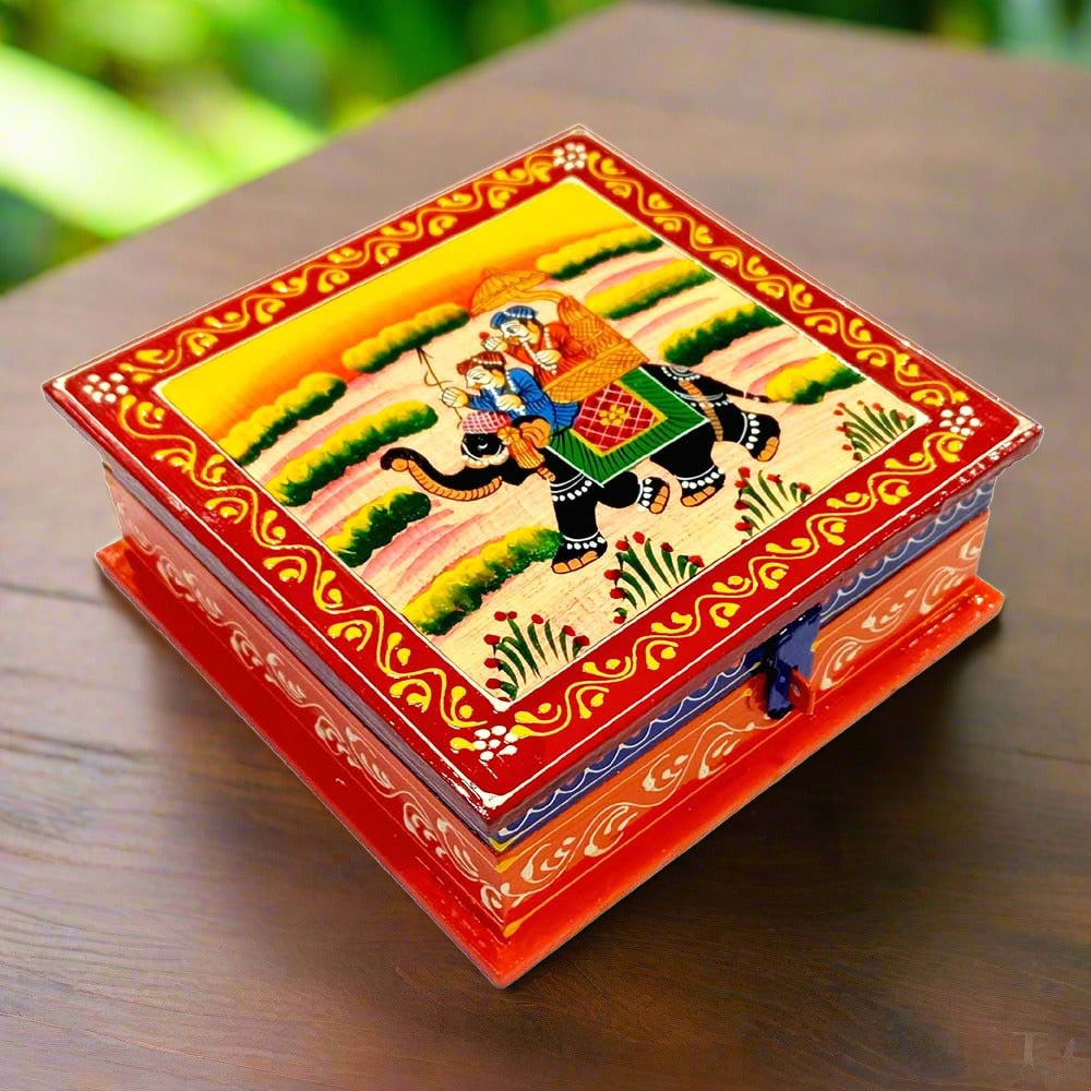 A Rajasthani hand-painted wooden jewel box with a beautiful and intricate design.