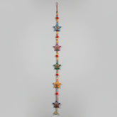 3 feet long handmade Rajasthani star-shaped wall hanging with hand-painted stars and decorative brass bell.