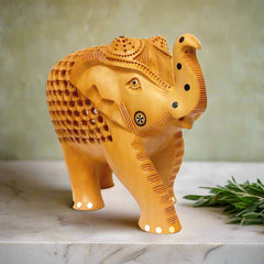 Rajasthani wooden elephant sculpture with delicate inlay work on trunk, cheeks and hooves.