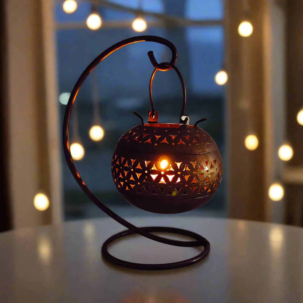 Round metal tealight candle holder with artistic design
