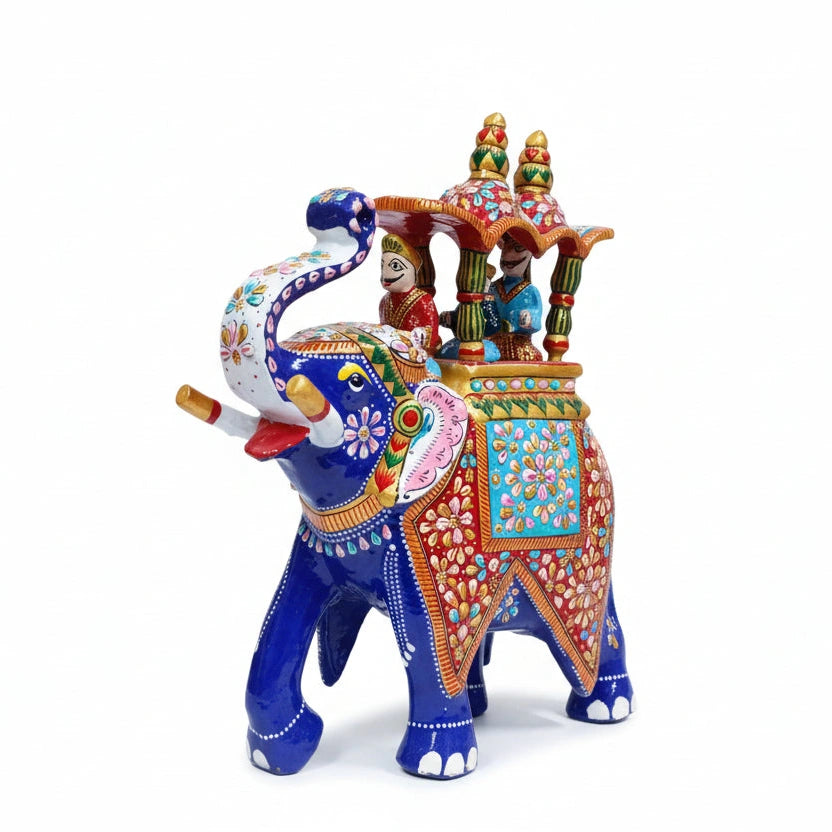 Side view of royal heritage elephant showing the King and Mahavat details. 12 inch metal decor.