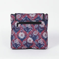 Rear view of the floral sling bag highlighting the secure back side zipper pocket
