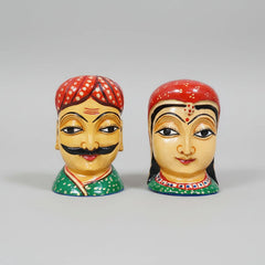 Set of 2 wooden Rajasthani couple figurines with traditional hand-painted details.