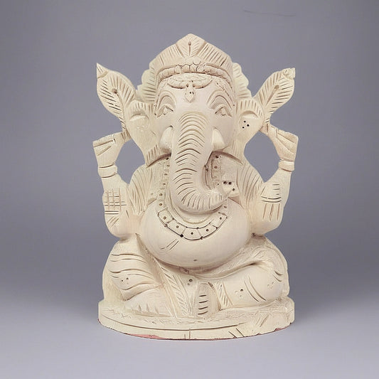 Handcrafted 13cm Shriparni Sevan wood Ganesh statue for home pooja and wealth prosperity.