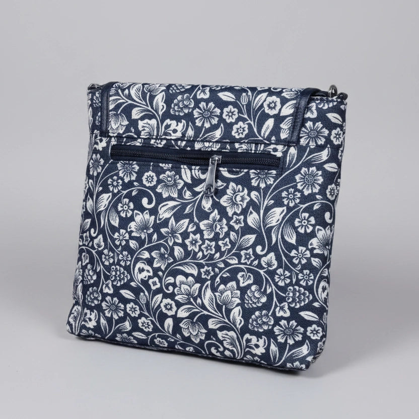Rear view of the floral bag highlighting the secure back exterior zipper pocket for valuables