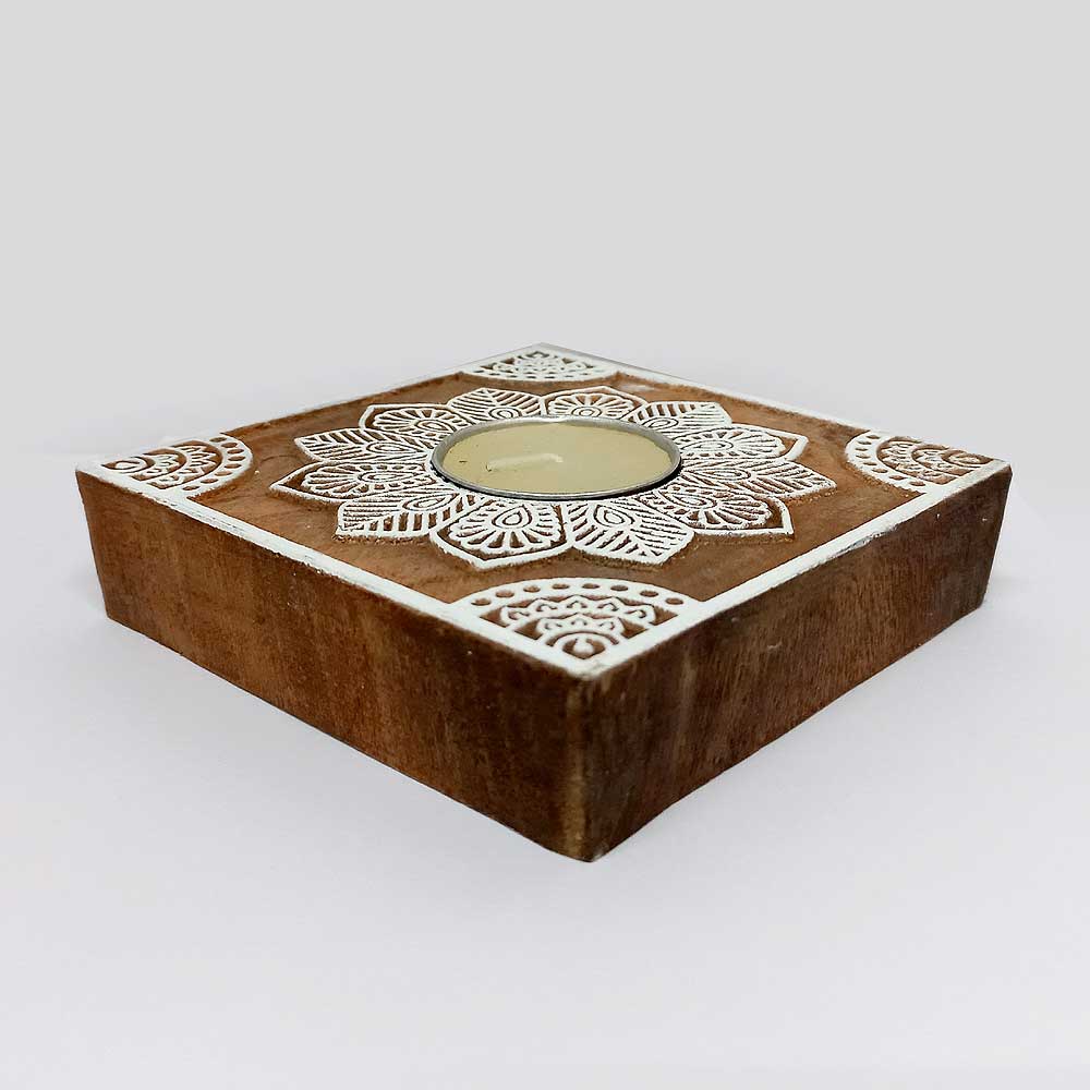 A solid wood, cube-shaped candle holder, a perfect minimalist gift.