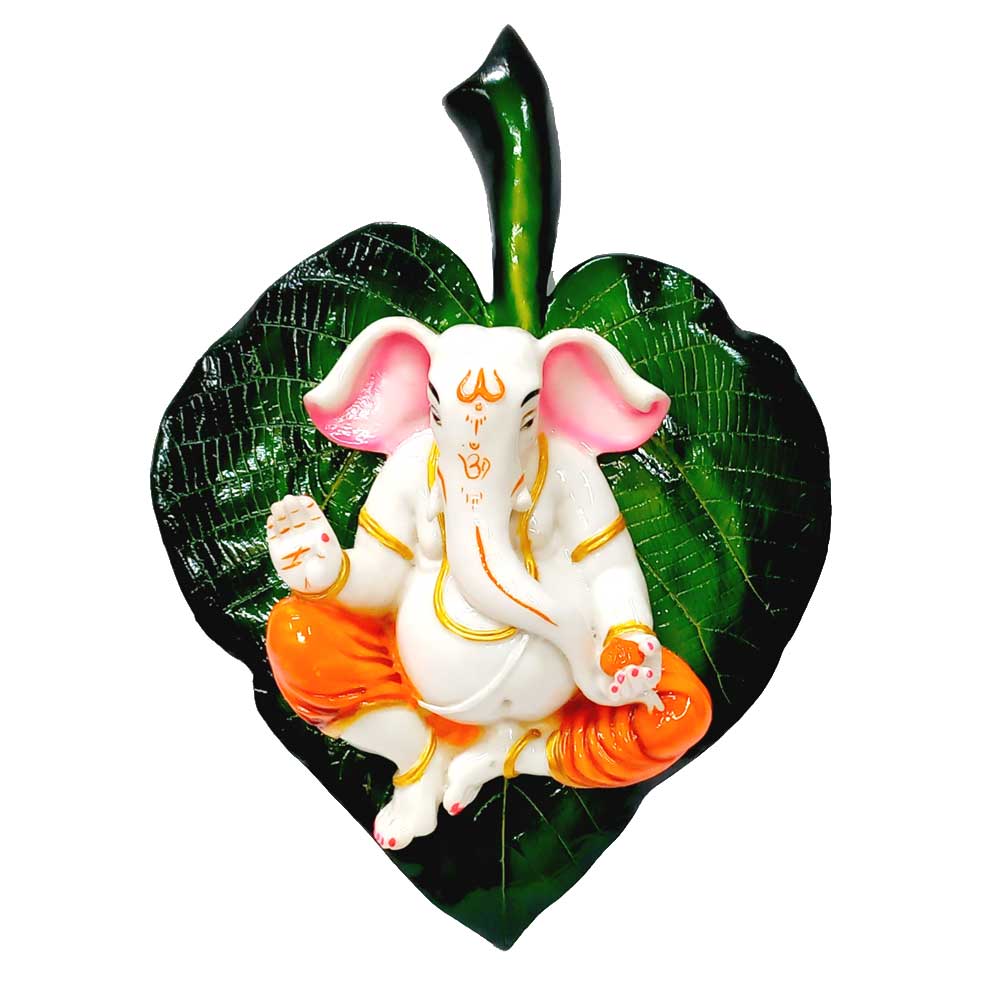 A spiritual Ganesha on a green leaf, a unique wall sculpture for home decor.