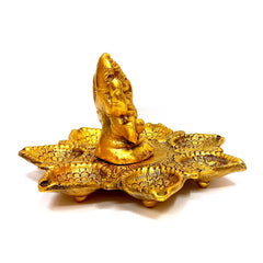 A spiritual metal Ganesha idol, ideal for placing on a dedicated altar or in a pooja room.