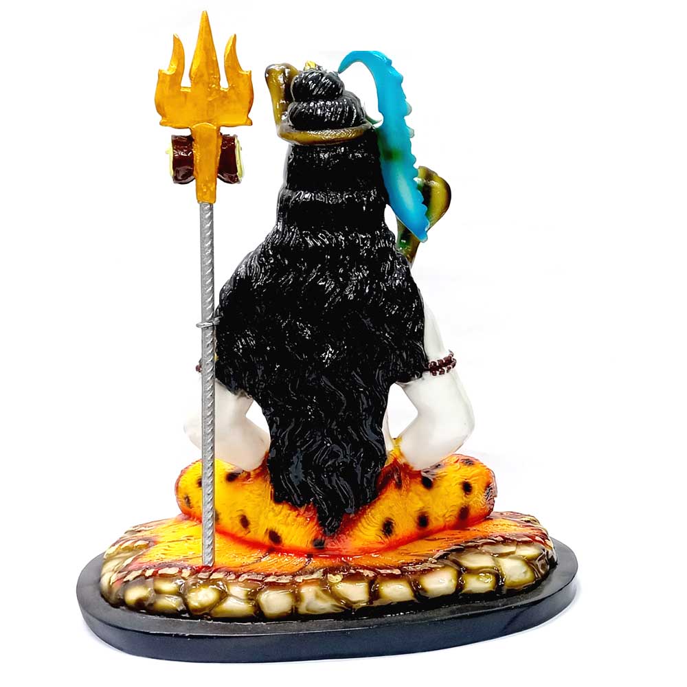 A spiritual Lord Shiva sculpture with a serpent and crescent moon, radiating peace and divinity.