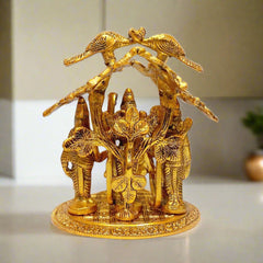 A metal statue depicting Lord Rama, Sita, Lakshman, and Hanuman standing together.
