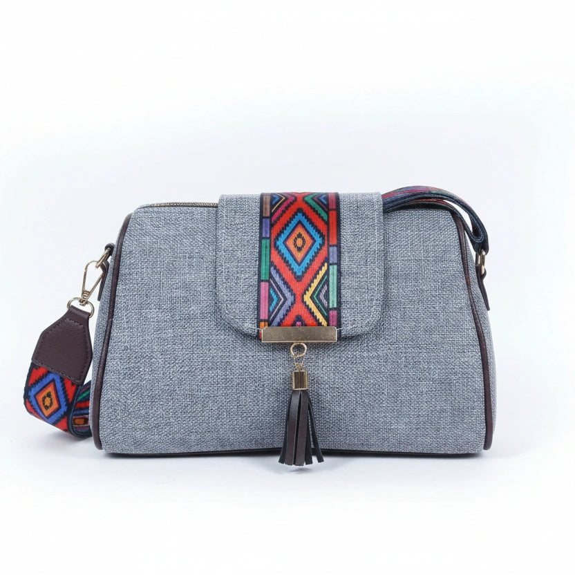 Women's textured jacquard and vegan leather sling bag with printed flap