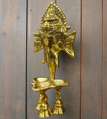 A Ganesha metal wall hanging with a traditional design that complements both modern and traditional decor.