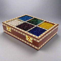 Unique gemstone wooden jewelry box with golden lock and artistic design.
