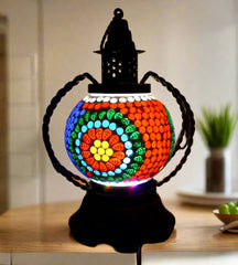 A unique mosaic table lamp that creates a warm and welcoming ambiance in any room.