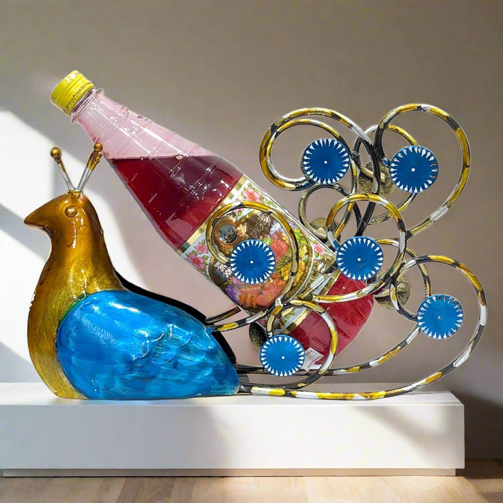 A unique metal bottle holder with the bottle space elegantly placed within the peacock's feathers.