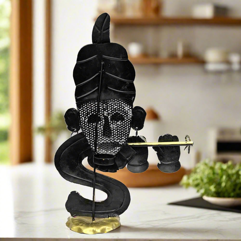 A metal Krishna statue with a unique texture and a different, beautiful shape.