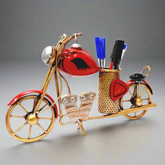A vintage Bullet bike pen stand with an antique look, a unique accessory for any table.