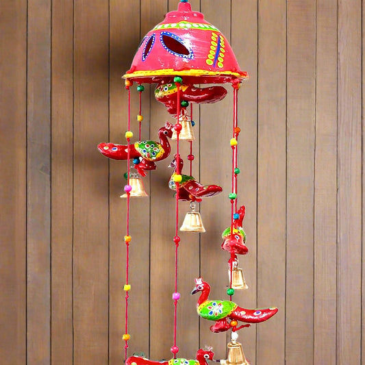 A beautiful wall decor toran made of paper mache, ideal for a pooja room or hall.