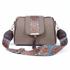 Women's jacquard crossbody sling bag with printed flap and leather tassel