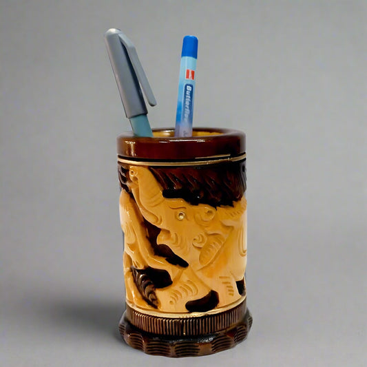 Round wooden pen stand with hand-carved animal figures