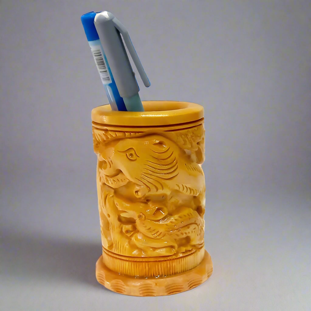 Handcrafted wooden pen stand with circular shape and intricate carvings
