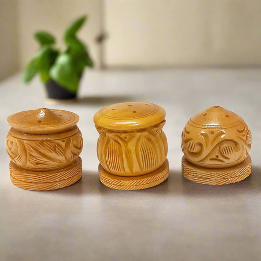 A set of 3 carved wooden agarbatti holders, perfect for a pooja or worship room.