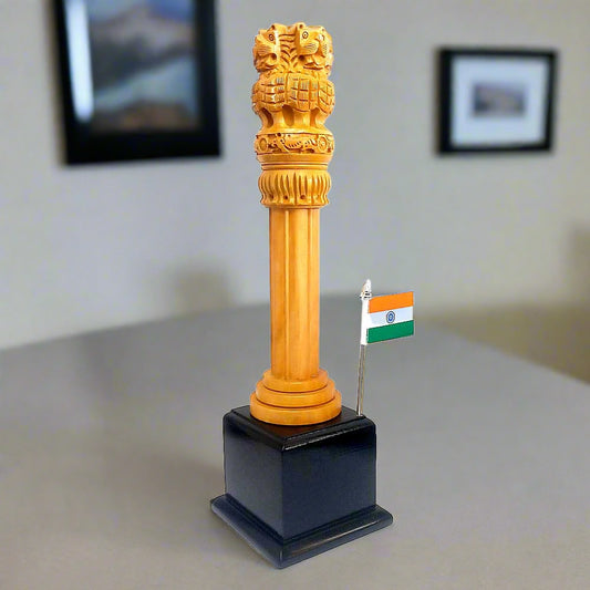 A wooden Ashoka Stambh, or Ashoka Pillar, with the Indian National Flag attached.