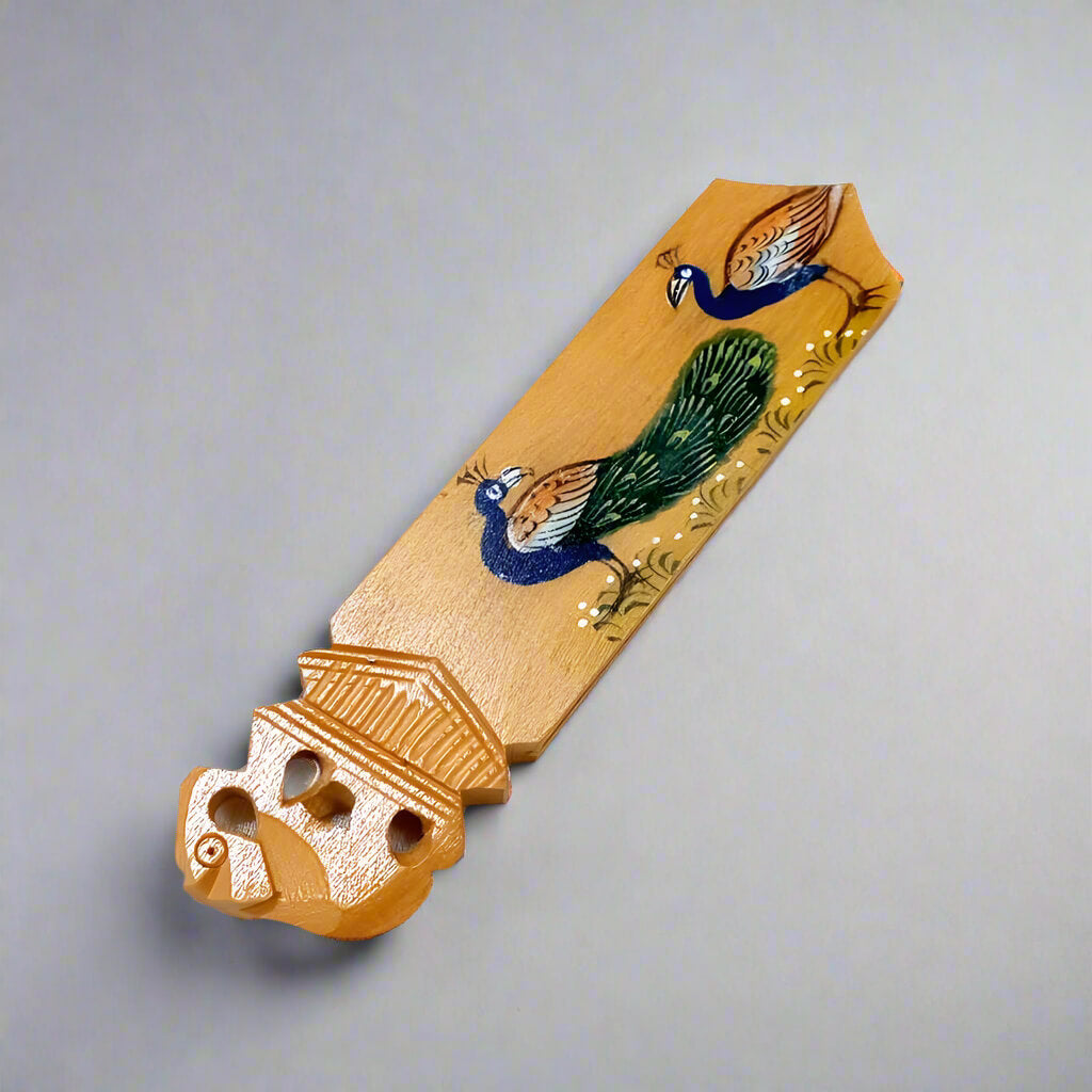 A wooden bookmark decorated with beautiful hand painting, a perfect gift for personal use or gifting.