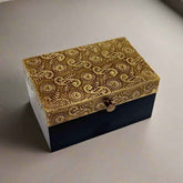 Handcrafted wooden box featuring ornate brass inlay on top. Classic antique finish makes it ideal for décor or storing precious items.
