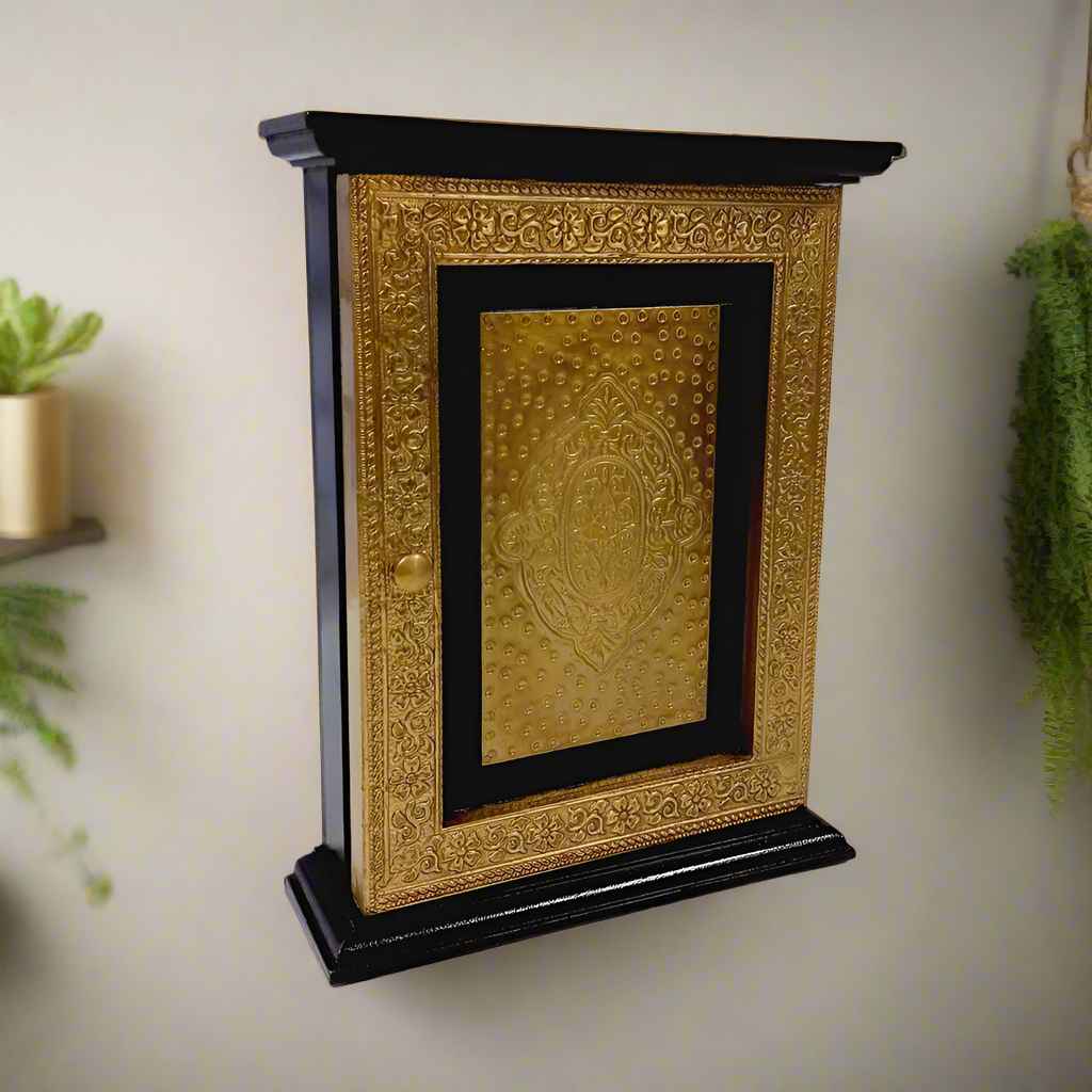 Wall-mounted wooden key holder box with antique brass foil detailing and hidden key storage design.