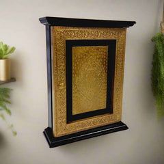 Wall-mounted wooden key holder box with antique brass foil detailing and hidden key storage design.