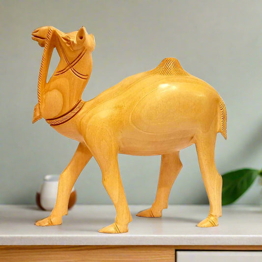 A wooden camel sculpture, also known as the ship of the desert, made from a single piece of wood.