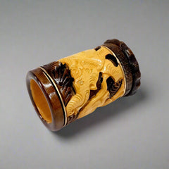 Artisan-crafted pen stand featuring detailed animal carvings