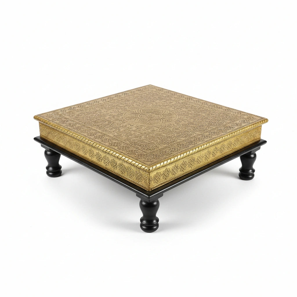 Strong wooden chowki stool being used for sitting during a traditional puja or wedding ceremony.