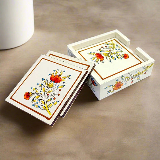 A wooden coaster set with a holder, featuring a beautiful handmade floral design.
