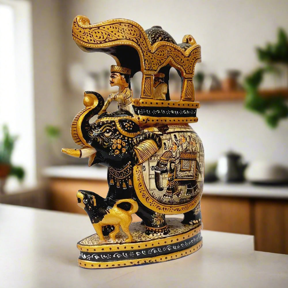 A wooden elephant figurine depicting a king riding and a lion at its feet, a true showpiece.