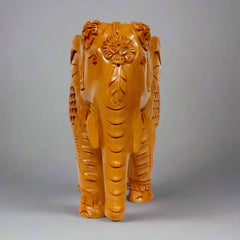 Traditional wooden elephant idol, unique Indian handicraft piece.