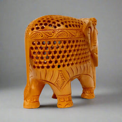Elegant wooden elephant showpiece with undercut carving work.